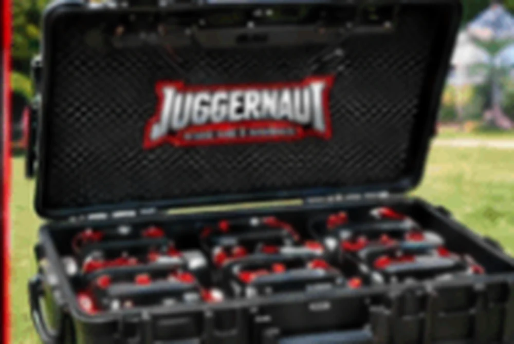 Open hard case filled with Juggernaut taggers for the Starter Package